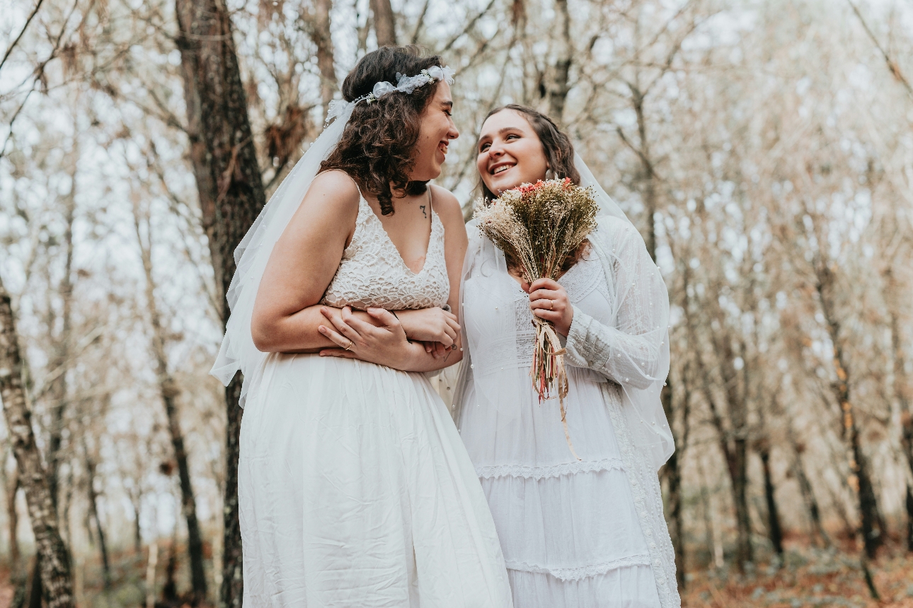 two women getting married outdoors