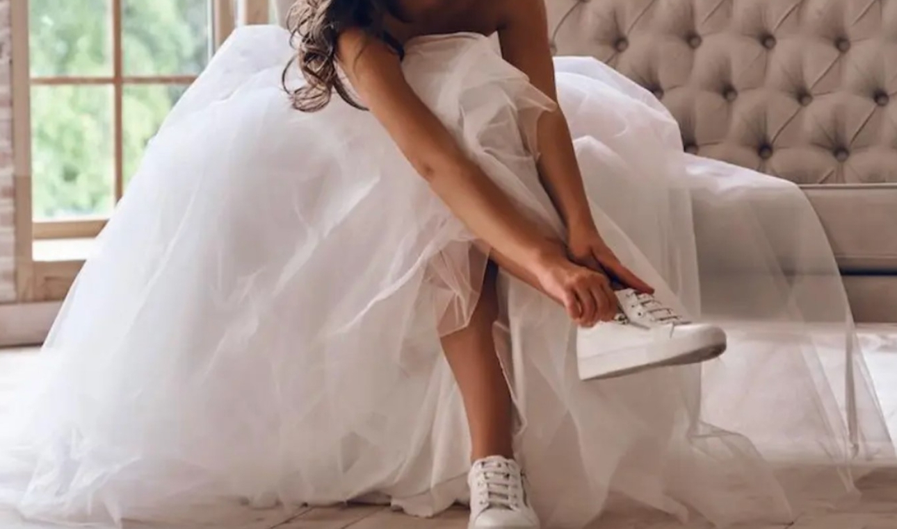 bride putting trainers on