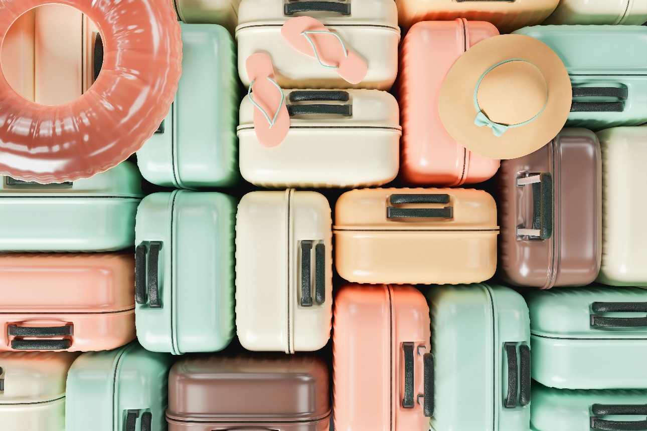 lots of coloured suitcases grouped together 