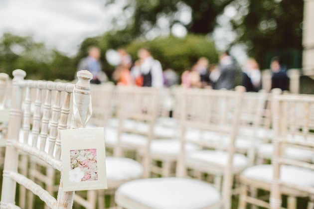 personalised seating arrangement with wedding guests in background