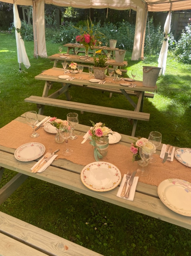 wooden tables under gazebo