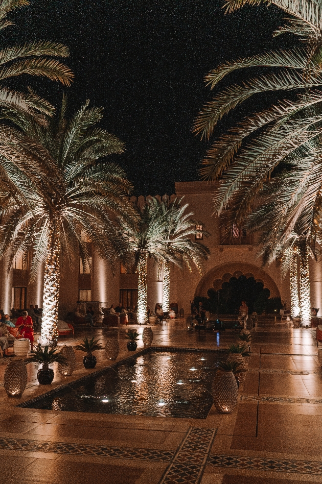 pool at hotel surrounded by palms