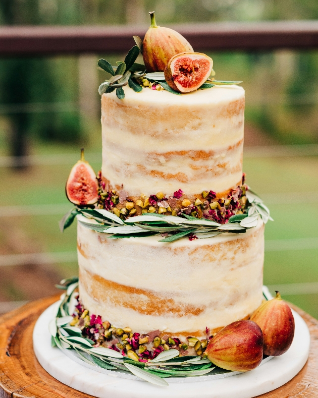 naked cake with figs on top and on layers