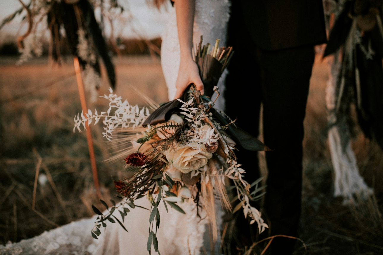 close of of bridal flowers held by bride