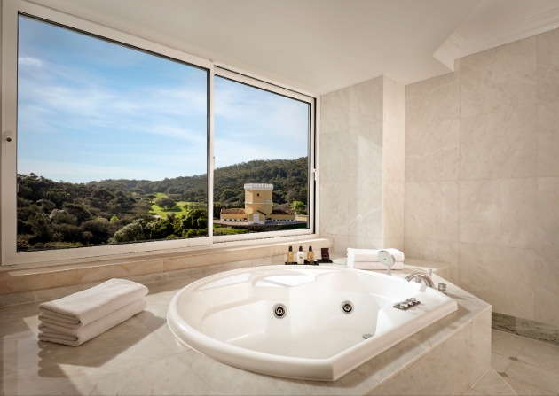 large bath with amazing views out of window