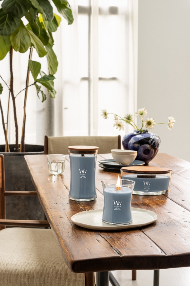 pale blue candles in three sizes in kitchen